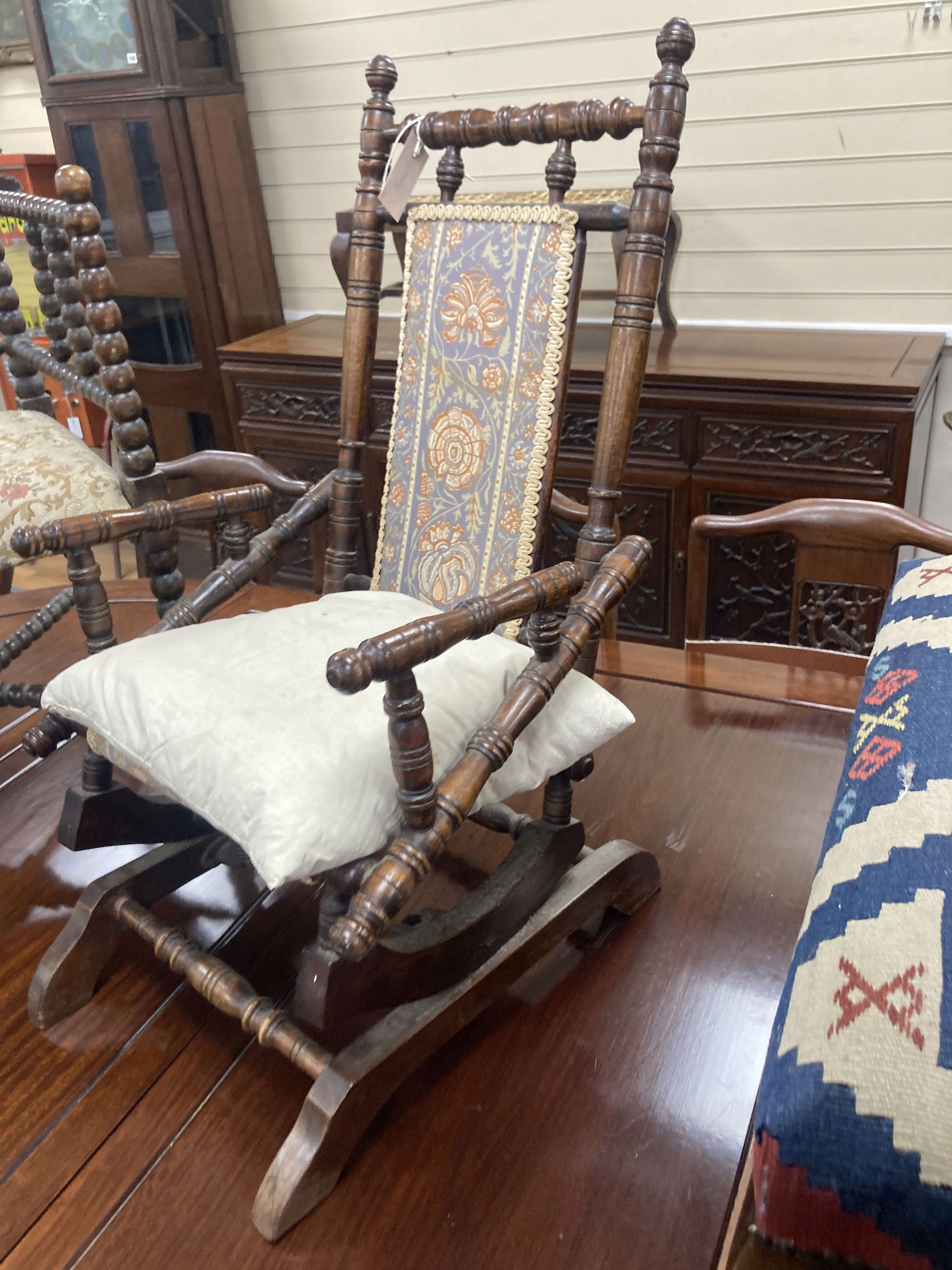 A Victorian childs rocking chair, width 33cm, depth 47cm, height 74cm together with a Victorian bobbin turned corner armchair, width 5